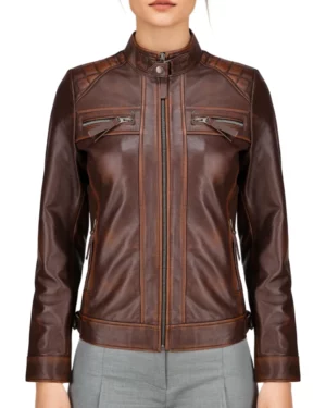 Women’s brown leather biker jacket – front view showcasing slim fit, zip-up closure, and quilted shoulder details for a sleek moto look.