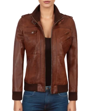 Women's brown leather bomber jacket with hood – front view showcasing zip closure, chest pockets, and ribbed hem for a snug fit.