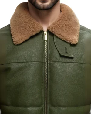 Detailed close-up image highlighting premium brown shearling collar texture, durable front zipper, and rich olive-green leather finish on men’s bomber jacket