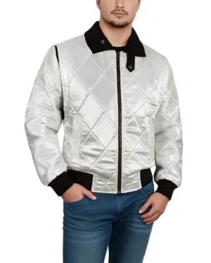 Front view of a man wearing a white satin quilted bomber jacket with black ribbed collar and cuffs, inspired by the Drive movie, paired with blue jeans.